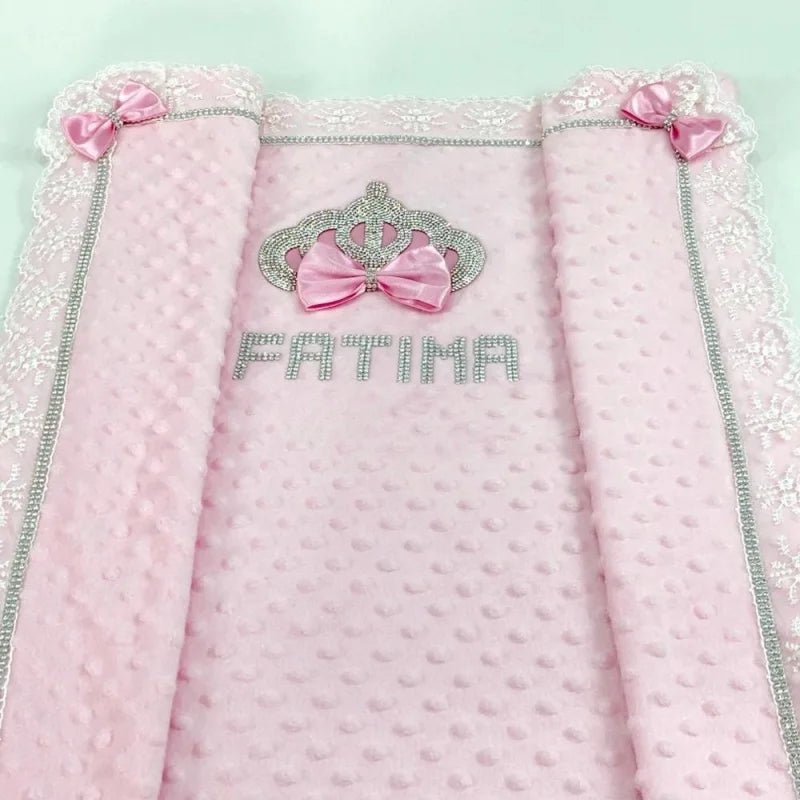 Pink Minky baby blanket with raised dots, lace trim, crystal crown, silver trim, pink bows, and FATIMA rhinestone name.