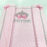 Pink Minky baby blanket with raised dots, lace trim, crystal crown, silver trim, pink bows, and FATIMA rhinestone name.
