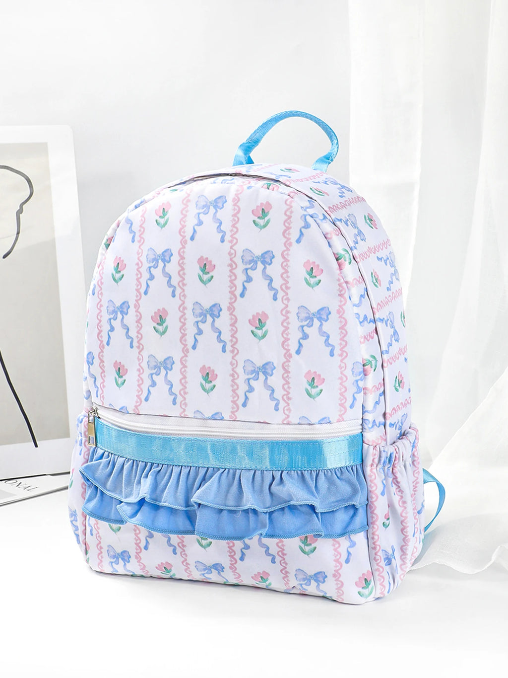 Flowers & Bows Floral Printed Backpack for School and Fun Activities showcasing vibrant floral patterns, perfect for young girls and stylish outings.