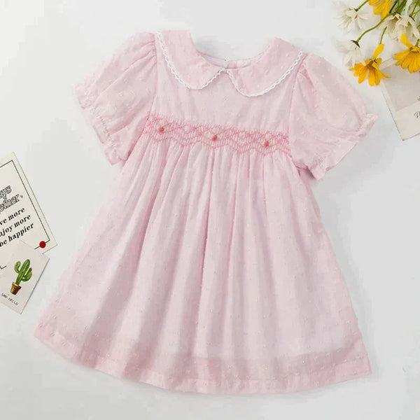 baby pink smocked party dress with puff sleeves and peter pan collar for infants