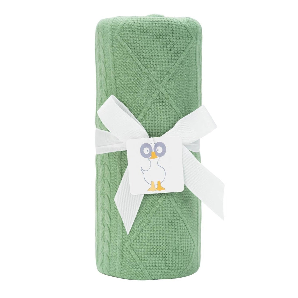Sage Knit Blanket by Goosewaddle® wrapped neatly with a ribbon, showcasing its soft green texture, perfect for newborns.