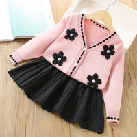 Vanessa Floral Knitted Cardigan and Pleated Skirt two-piece set: pink cardigan with black flower appliques.