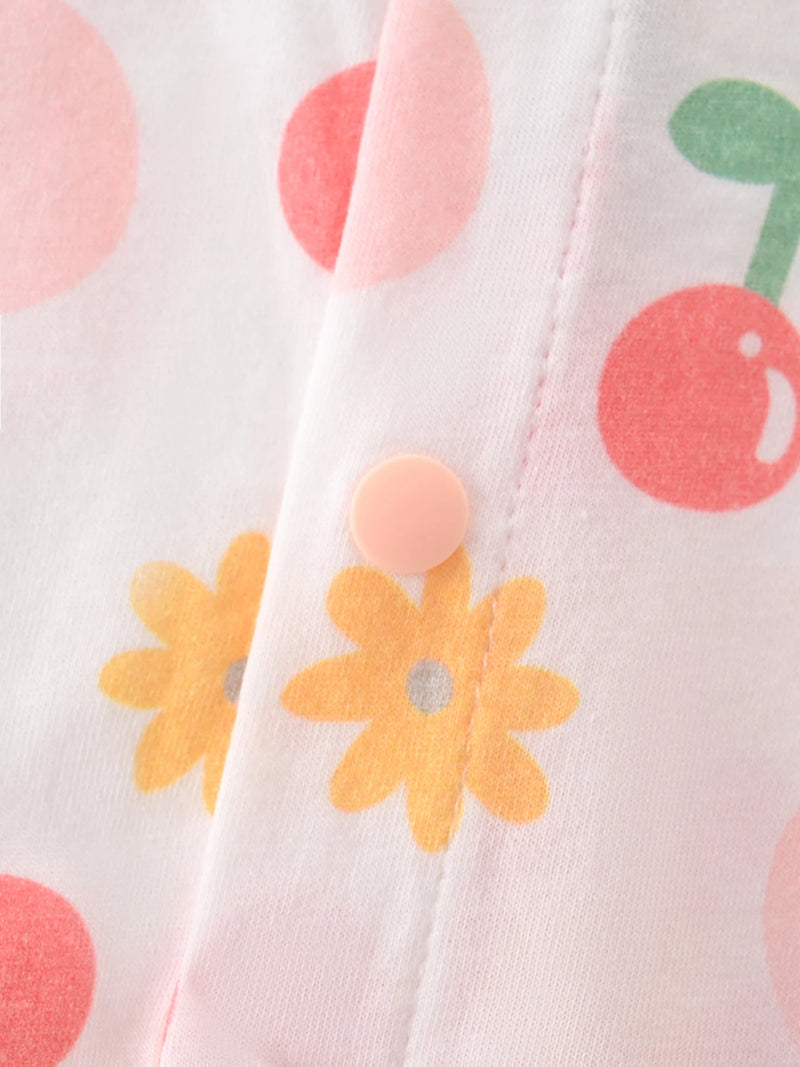 Close-up of the snap button on the Floral Baby! Romper Outfit, emphasizing its convenience for parents. Ideal baby romper outfit for hassle-free diaper changes.