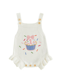 Cupcake-embroidered white knit romper overalls with button straps for a 1st birthday.