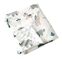 Soft dotted minky blanket with colorful animal prints (elephants, giraffes, and rhinos) on white, folded.