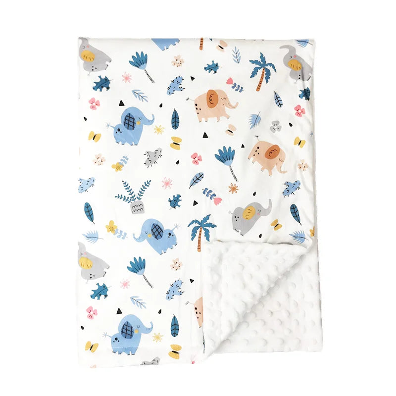 Soft white minky baby blanket featuring cute elephant and jungle animal print with plush dot texture backing for toddlers.