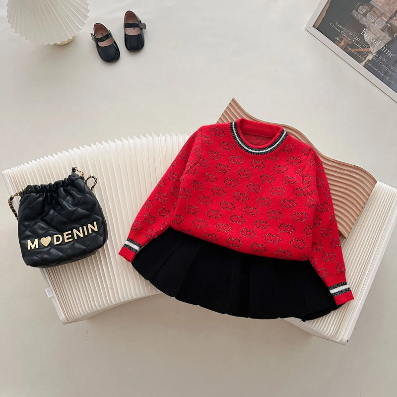 'Morgan' Classic Knit Skirt Set styled with accessories, featuring a red sweater and black short skirt, ideal for various occasions.