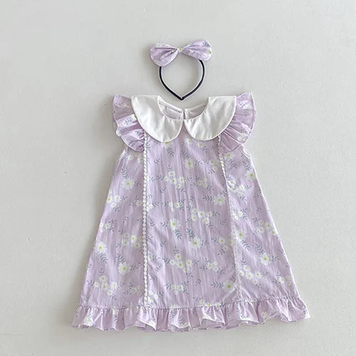 Vintage Outfits for girls featuring a lilac dress with floral patterns and a matching headband from The Palm Beach Baby.