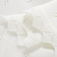White cotton knit baby baptism blanket with crochet accents, lightweight for christenings.
