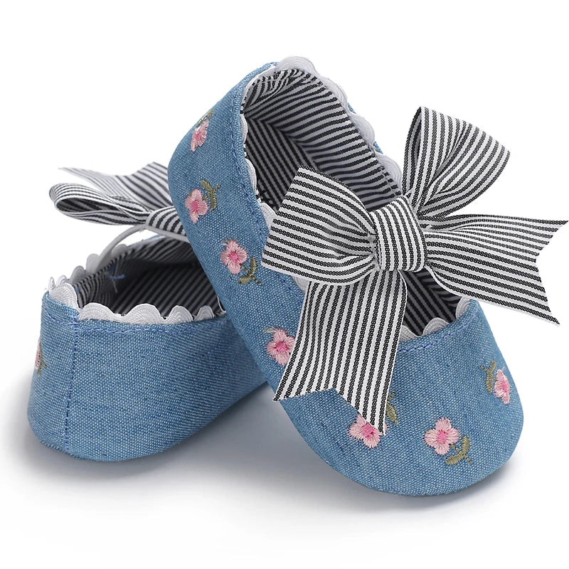 Girls' Mary Jane Soft Cloth Sole Flats Bow Detail in denim blue with embroidered flowers and striped bow.