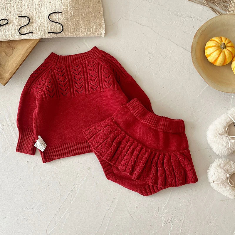 Close-up of the deep red Popcorn Knit Pullover and toddler skorts, designed for comfort and flair for little ones.