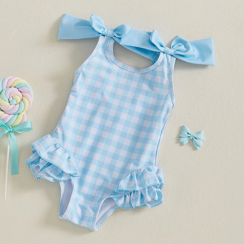 Cute In Checks cute swimsuit for kids in blue with shoulder bows, perfect for warm weather playtime.