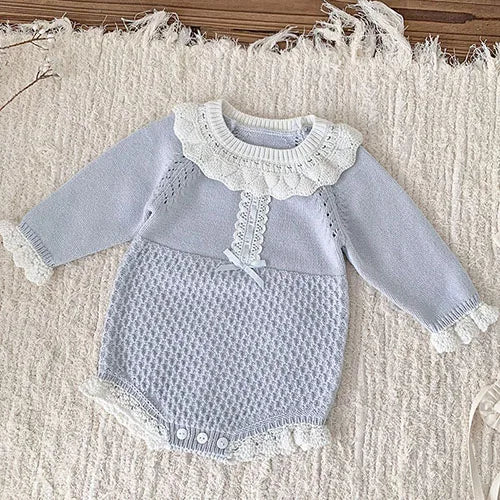 Pretty In Knit Baby's Romper in serene sky blue, a stylish choice for your little one's wardrobe.