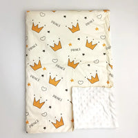 Cream lightweight baby blanket with orange crown prints and 'PRINCE' lettering; soft textured white Minky reverse.