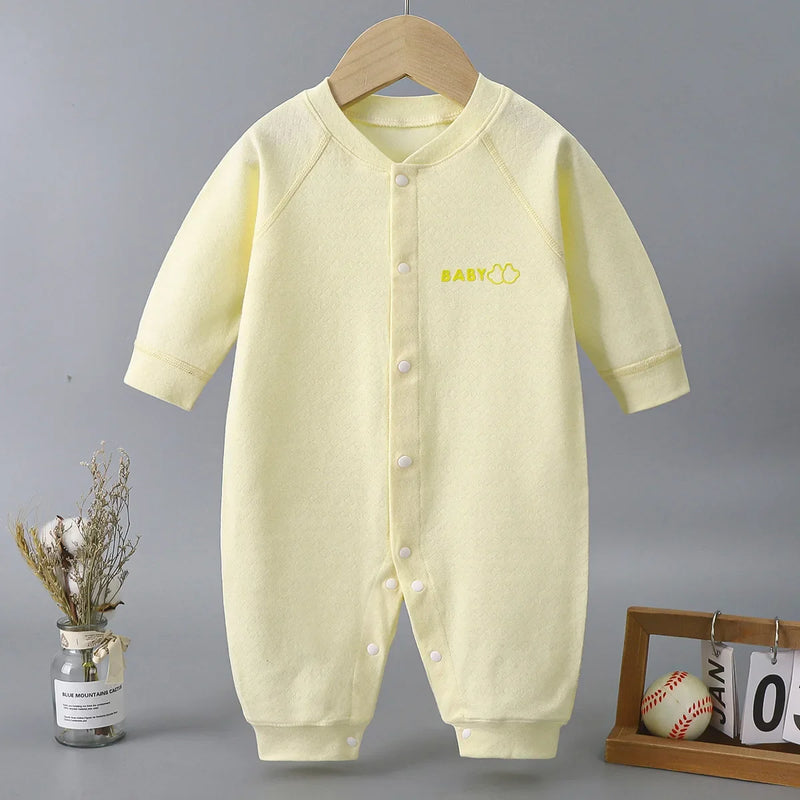Front view of the 'Yellow-licious' Baby's Romper, a soft yellow outfit with a snap-button closure and the word 'BABY' embroidered, ideal for ages 6 to 18 months.