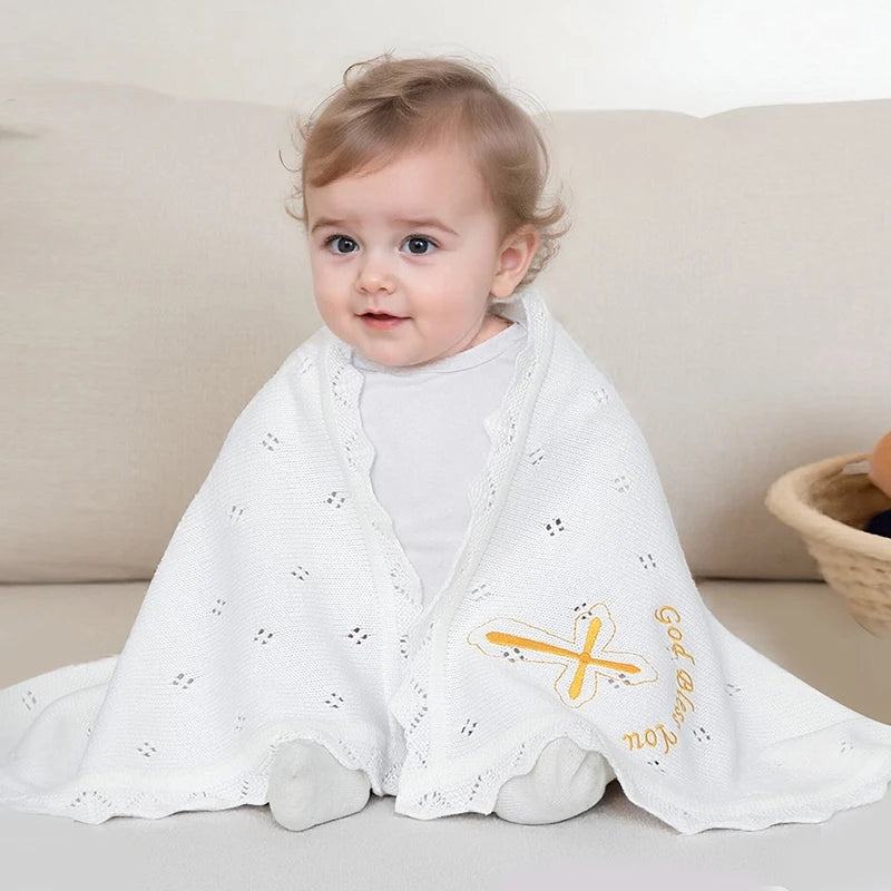 White cotton knit baby baptism blanket with gold cross and God Bless You embroidery, heirloom for christenings.
