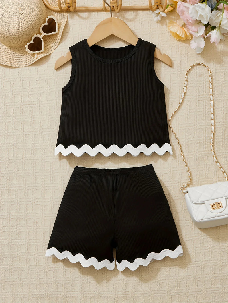 Chic Pamela Ann 2 PC Girls Shorts Set featuring a cozy black pullover and shorts with contrasting white scalloped details, perfect for warm weather.