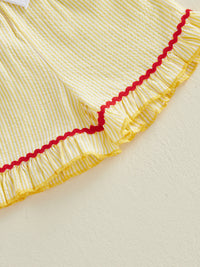 Yellow and white striped seersucker fabric with red wavy trim and yellow ruffle edge