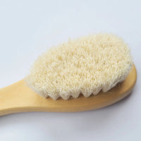 Wooden baby brush with soft bristles, part of a 2-piece baby care set for ages 0-36m