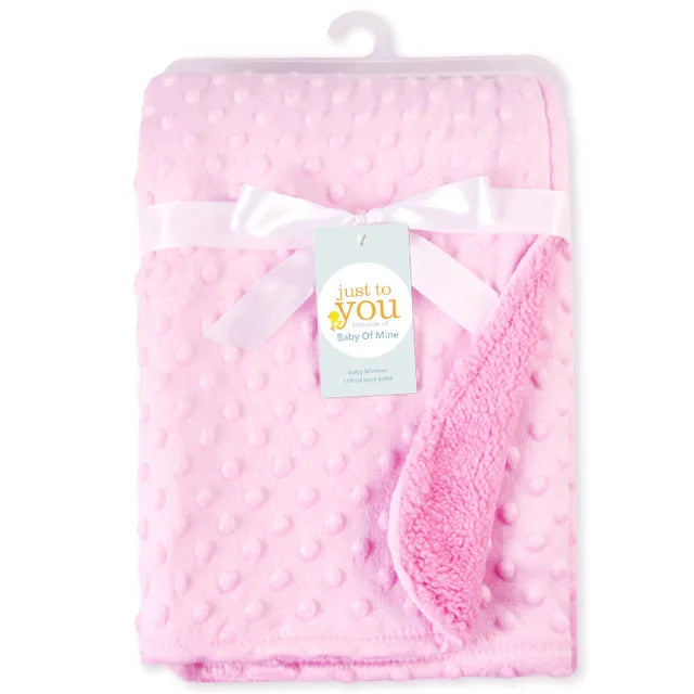 Pink soft fleece baby blanket with dotted texture, 100x70 cm, unisex for ages 0-3 years.