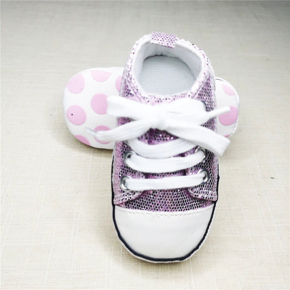 Baby's Canvas Lace-up First Walkers in Sparkling Purple, perfect for babies learning to walk, featuring breathable canvas and durable cork soles.