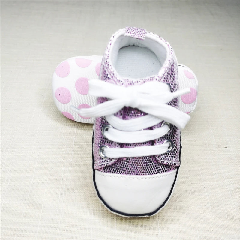 Baby's Canvas Lace-up First Walkers in Sparkling Purple, perfect for babies learning to walk, featuring breathable canvas and durable cork soles.