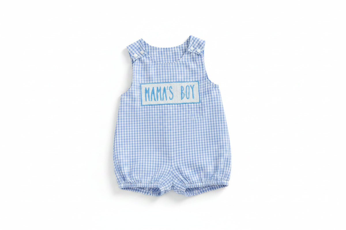 Blue checkered dress with 'MAMA'S BOY' text on a beige background