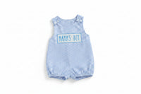 Blue checkered dress with 'MAMA'S BOY' text on a beige background