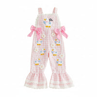 Pink checkered romper with bird designs on a beige background