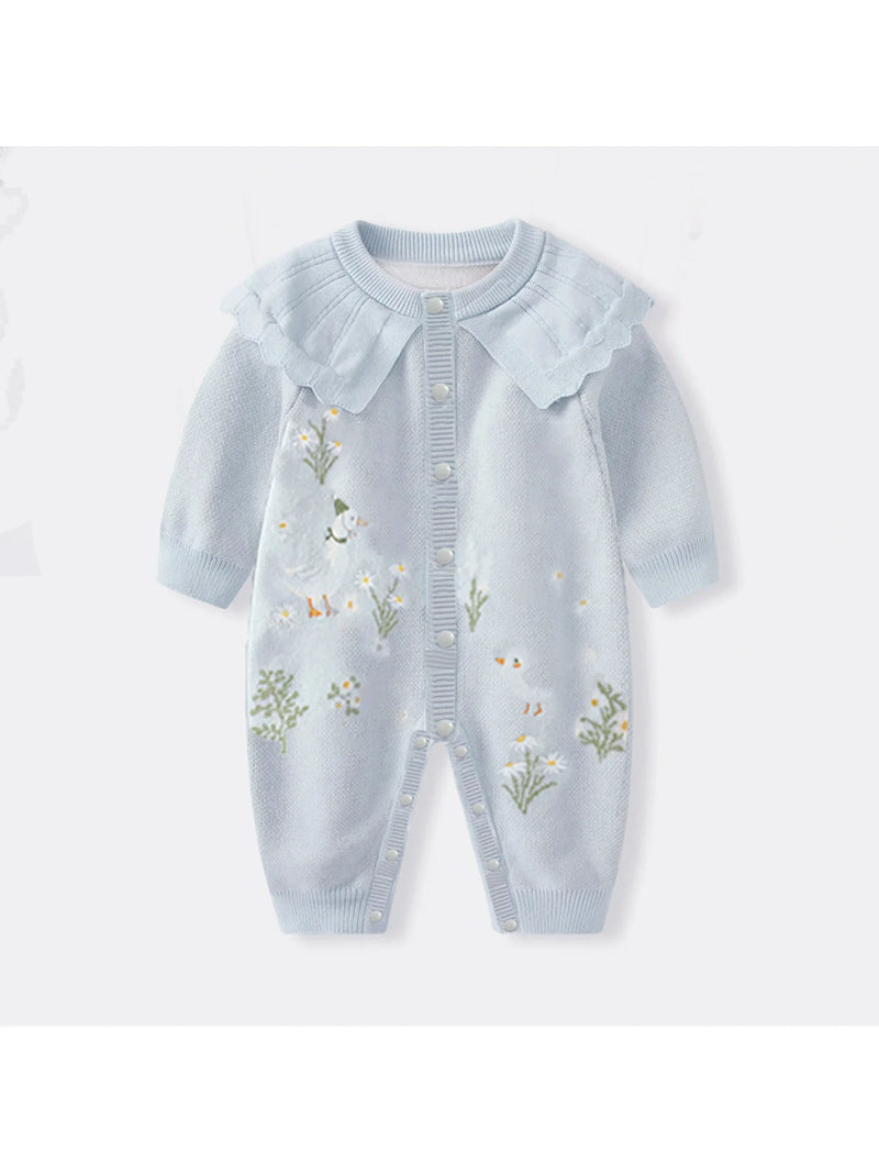 Close-up view of the Boca Blue Fleurs Knit Long Sleeve Baby Romper showing embroidered floral details and scalloped collar, ideal for special occasions and everyday wear.