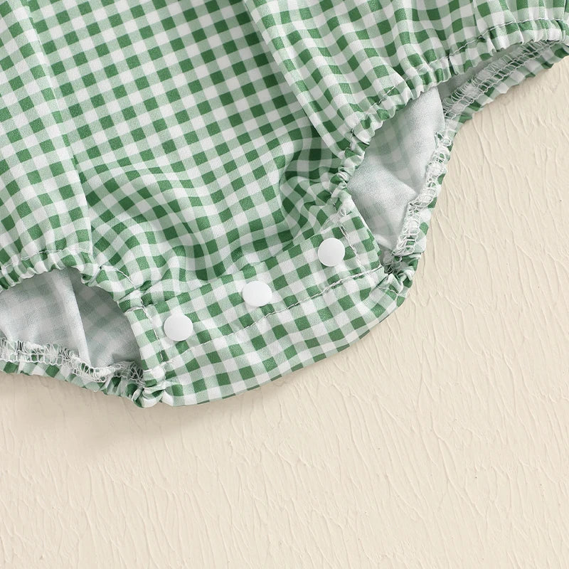 Close-up of the green gingham fabric of Holiday Cuteness Smocked Baby Bubbles highlighting the snap closure for easy diaper changes.