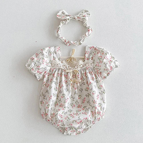 Vintage Outfits for toddlers, showcasing a floral romper with a matching hair scrunchie, ideal for comfort and style.