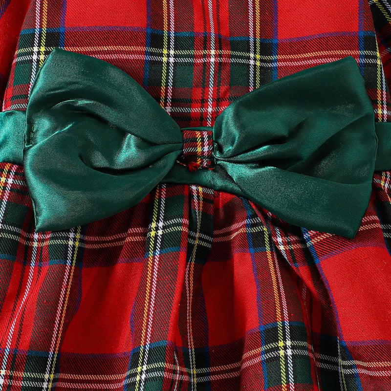 Detailed image of the adorable spruce satin bow on the Louisa Girls Red Plaid Bow Dress, adding a charming focal point to the playful design.