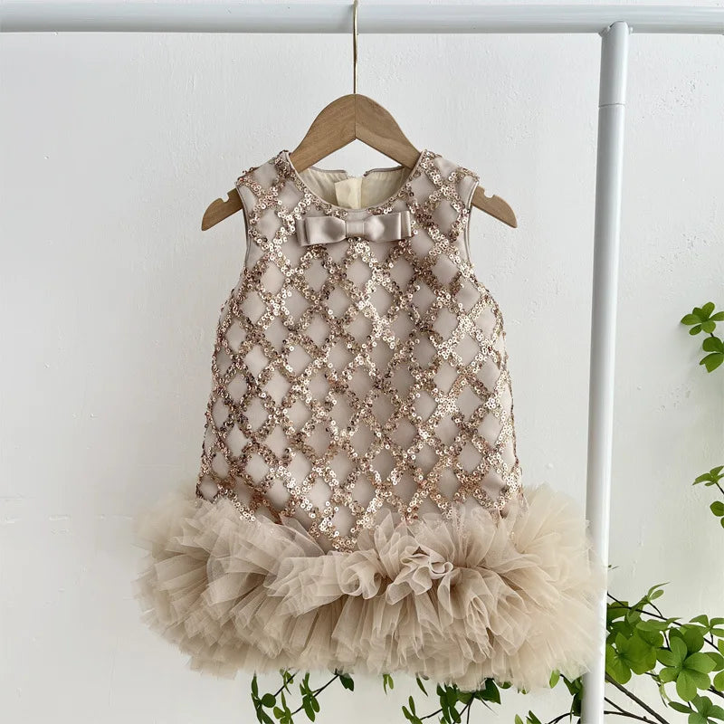 Isabella Elegant Sequined Dress for Little Girls in beige, hanging on display, showcasing its beautiful sequined design.