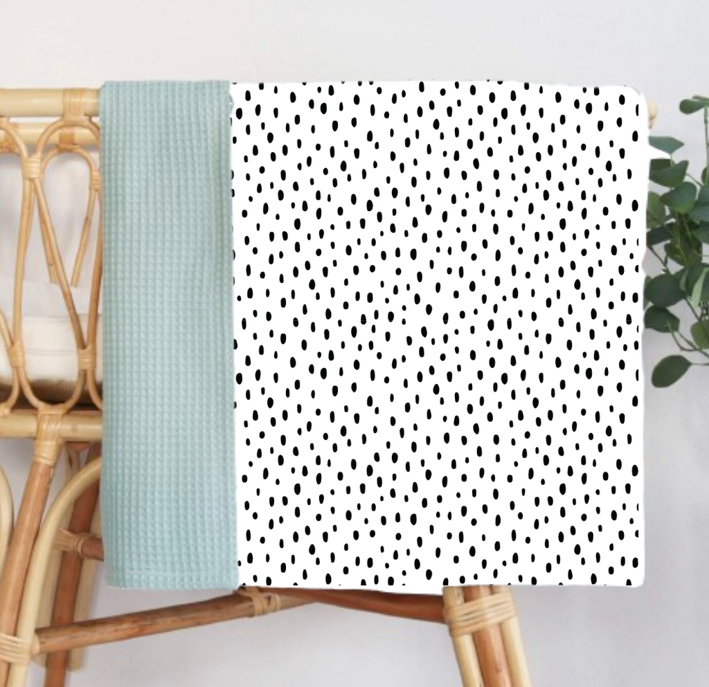 Polka Dot Muslin/Waffle Blanket by Growing Sprouts - a stylish, cozy blanket designed for babies and perfect for nursery decor.