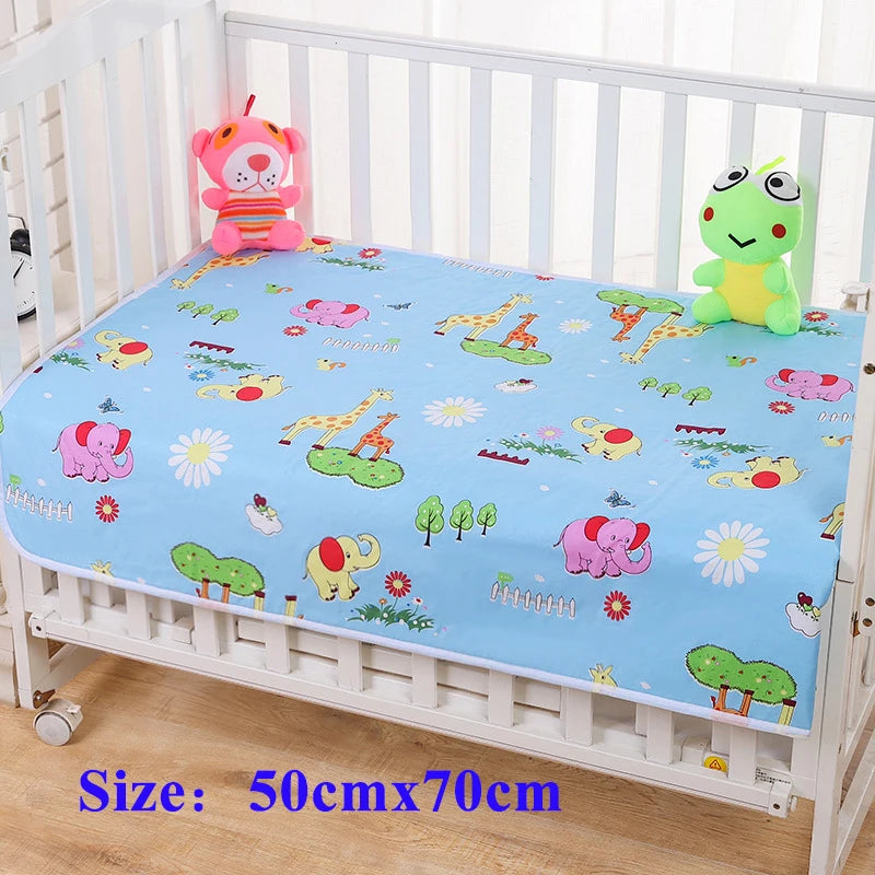 Children's waterproof changing pad cover with cute animal prints on a crib, 50x70 cm.
