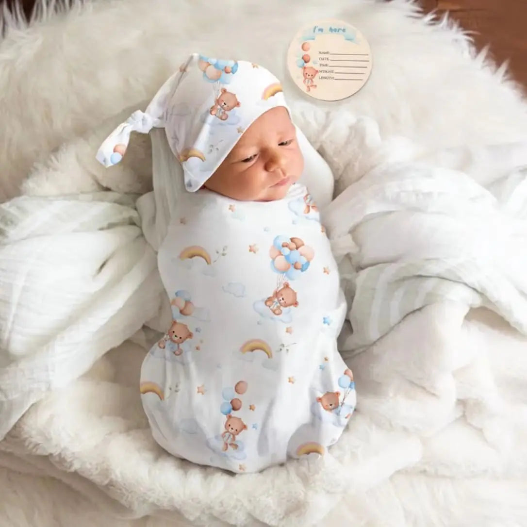 Baby swaddle and headband set with rainbow teddy bear print, perfect soft receiving blanket gift for newborns.