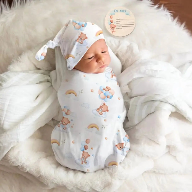 Baby swaddle and headband set with rainbow teddy bear print, perfect soft receiving blanket gift for newborns.