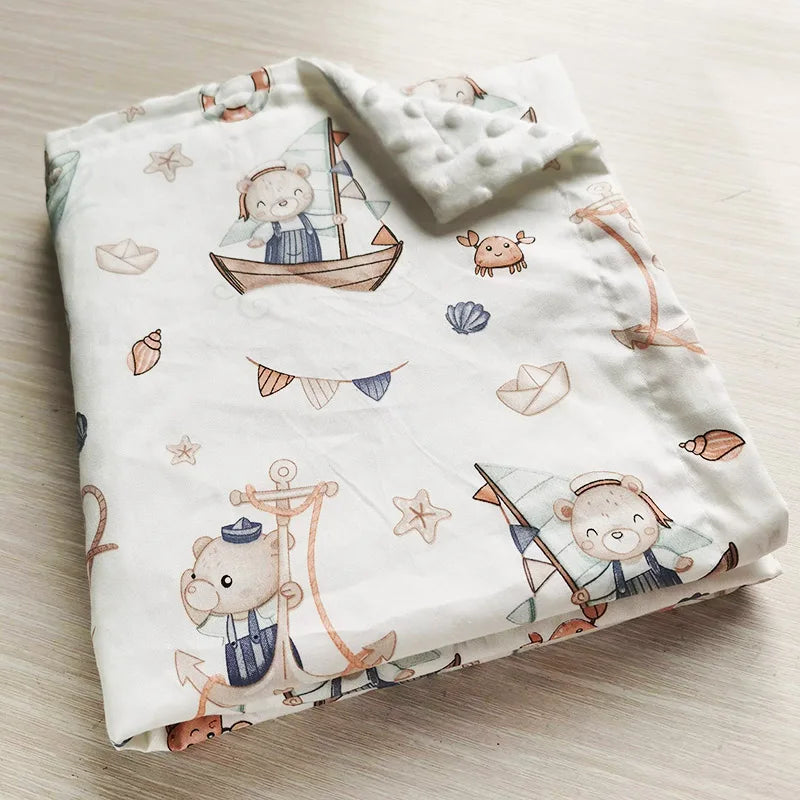 Nautical baby minky blanket featuring sailor bears, anchors, and boats. Ultra-soft 100x75cm polyester cotton blend perfect for toddlers and baby gifts.