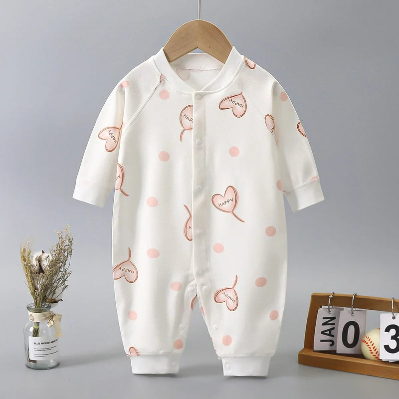 Adorable 'Little Hearts' Baby Romper for Girls featuring a playful heart print and polka dots, perfect for babies aged 6-18 months. Soft cotton comfort designed for playful moments.