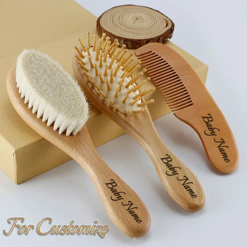 Personalized wooden baby grooming set with brush, bristle brush, and comb; handles engraved with child's name.
