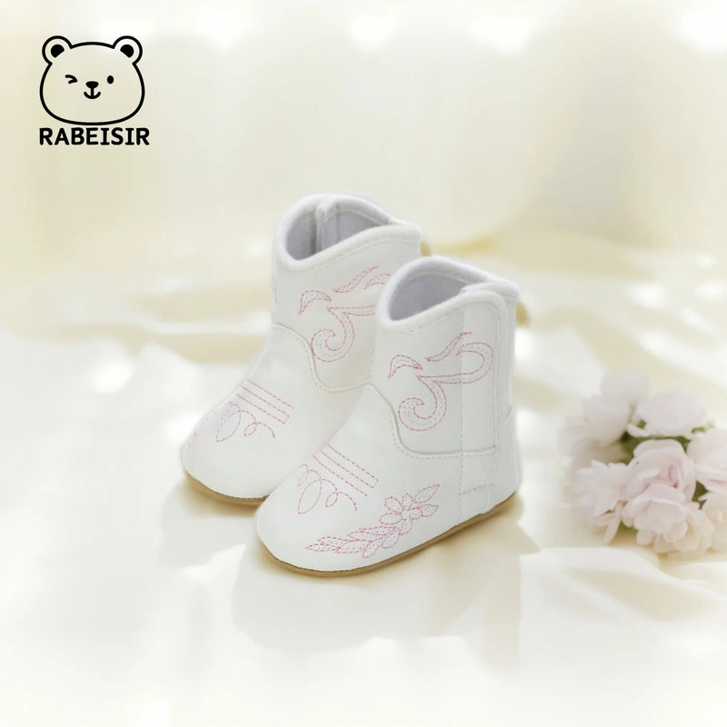 'Cowboy Kate' Anti-Slip Baby First Walker Boots displayed front-facing, highlighting the charming design and stitching.