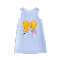 Blue seersucker sleeveless dress with bright yellow bow embroidery and pencil motif.