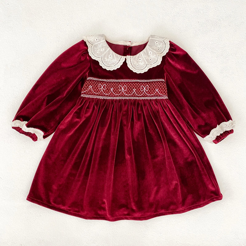 Deck the Halls Smocked Velvet and Frills Sibling Outfits - Deep Red; close-up of a beautiful deep red velvet dress featuring a lace collar, ideal for festive occasions.