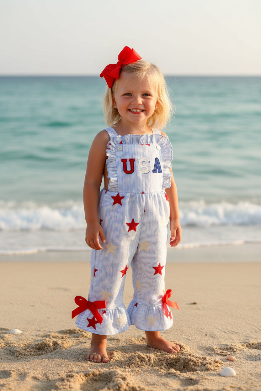 Children's romper with star pattern and 'USA' text on a white background