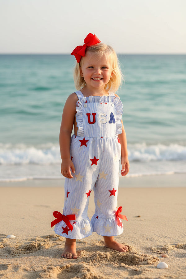Children's romper with star pattern and 'USA' text on a white background