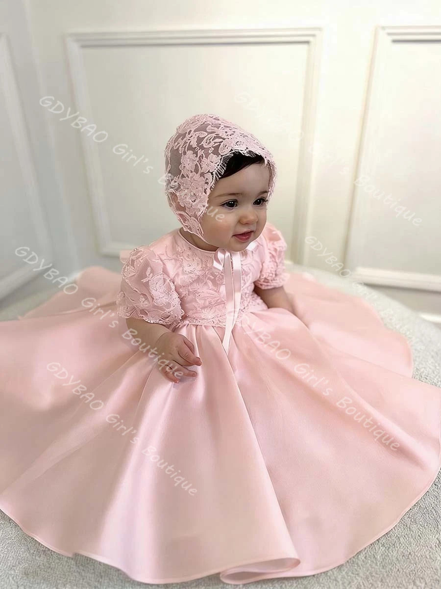 Hannah White beaded lace flower girl gown with matching bonnet in pink taffeta, bow and pearl details for weddings.