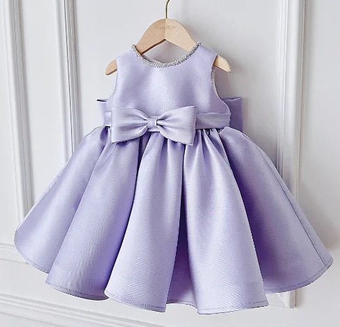 Patience Marie lavender beaded sleeveless princess dress for girls, knee-length with large satin bow at waist.