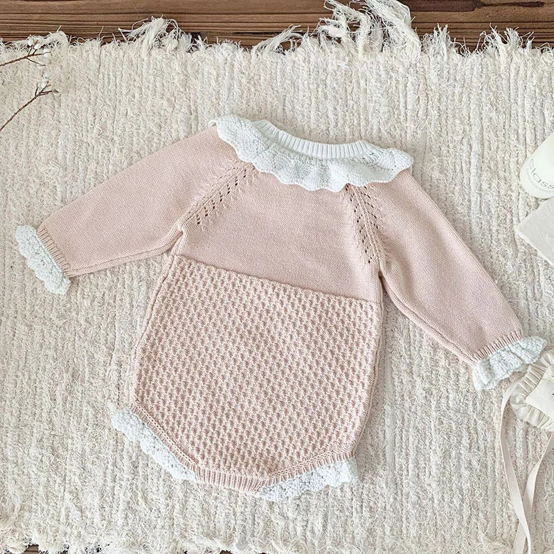 Baby wearing the Pretty In Knit Baby's Romper during a family gathering, demonstrating its versatility and style.