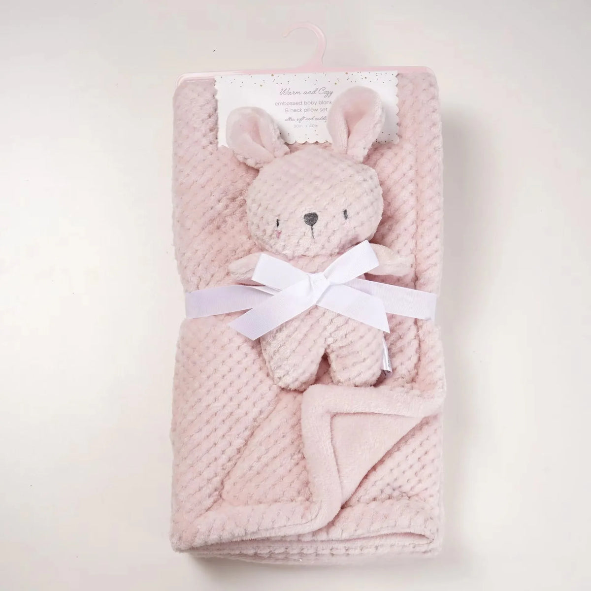 Soft pink knit baby blanket 2-piece set with plush bear head and white ribbon, ideal baby gift.